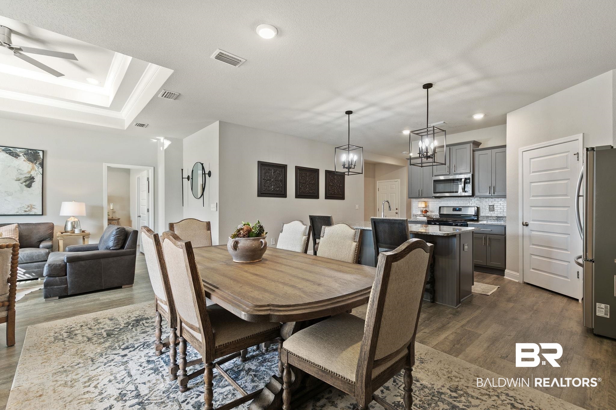 31650 Memphis Loop Daphne, AL 36527 - Photo 16 of 68 Dining room with dark wood-style floors, suspended lighting, and a ceiling fan