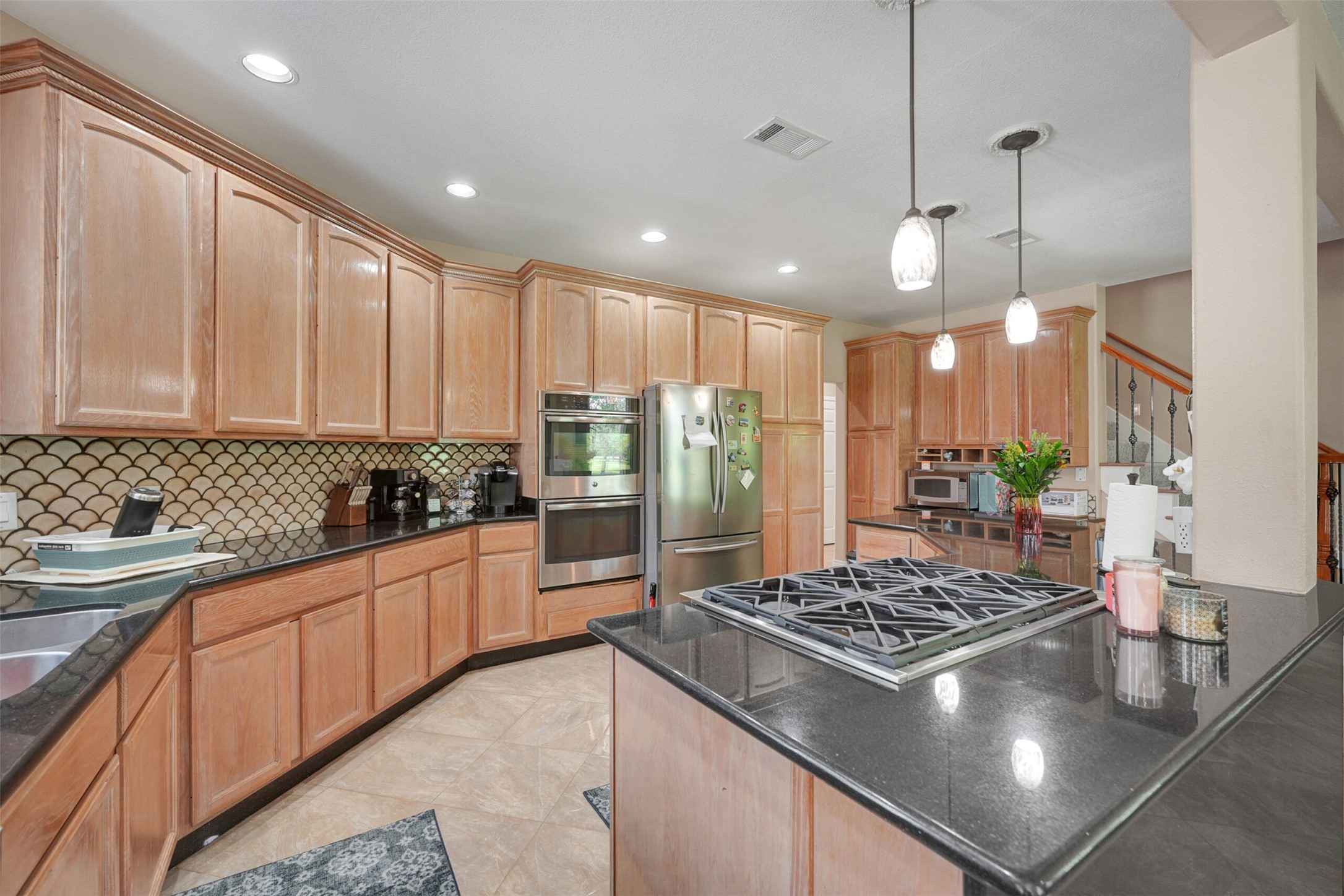 2750 County Road 48 Rosharon, TX 77583 - Photo 12 of 40 a kitchen with stainless steel appliances granite countertop a stove sink and cabinets