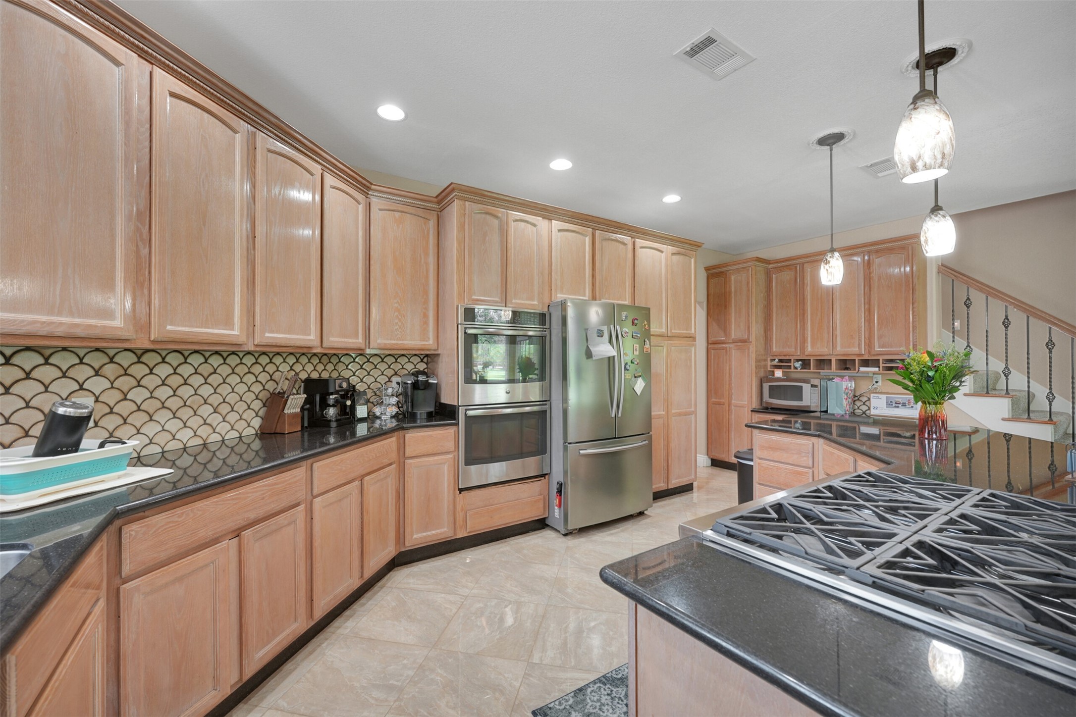 2750 County Road 48 Rosharon, TX 77583 - Photo 15 of 40 a kitchen with stainless steel appliances granite countertop a stove refrigerator and cabinets