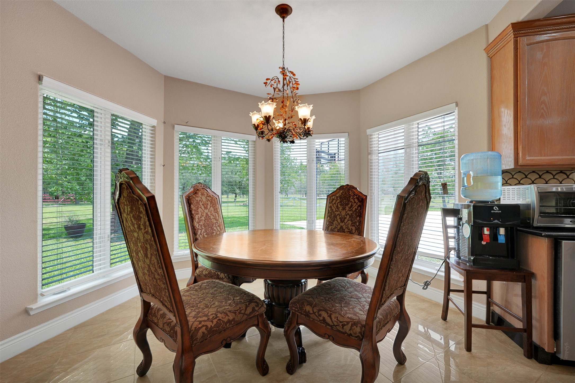 2750 County Road 48 Rosharon, TX 77583 - Photo 16 of 40 a dining room with furniture a chandelier and wooden floor