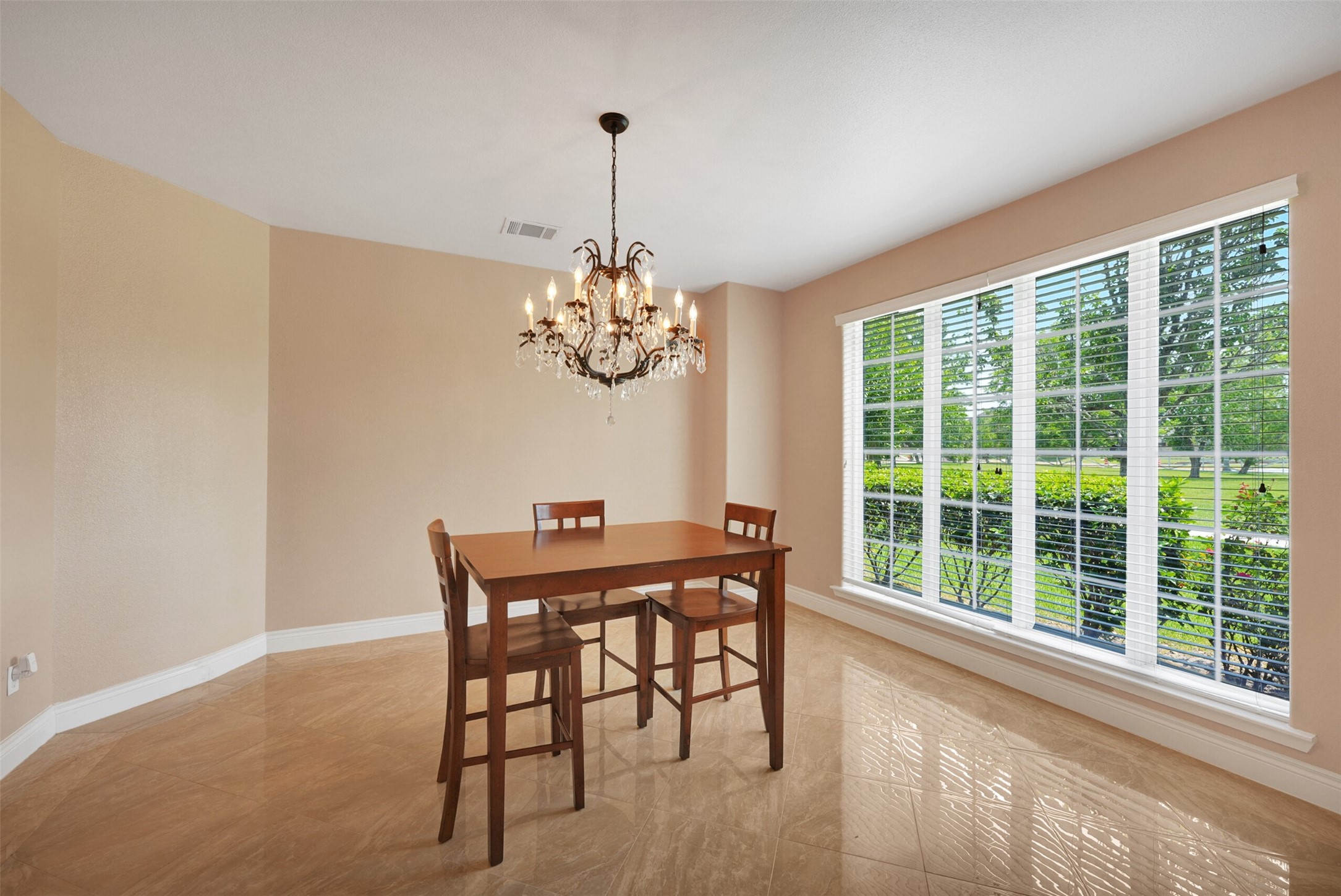 2750 County Road 48 Rosharon, TX 77583 - Photo 17 of 40 a view of a dining room with furniture a chandelier and wooden floor