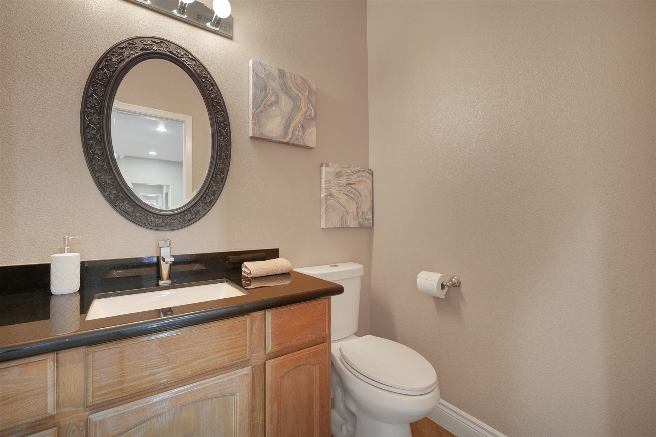 2750 County Road 48 Rosharon, TX 77583 - Photo 18 of 40 a bathroom with a toilet a sink and a mirror