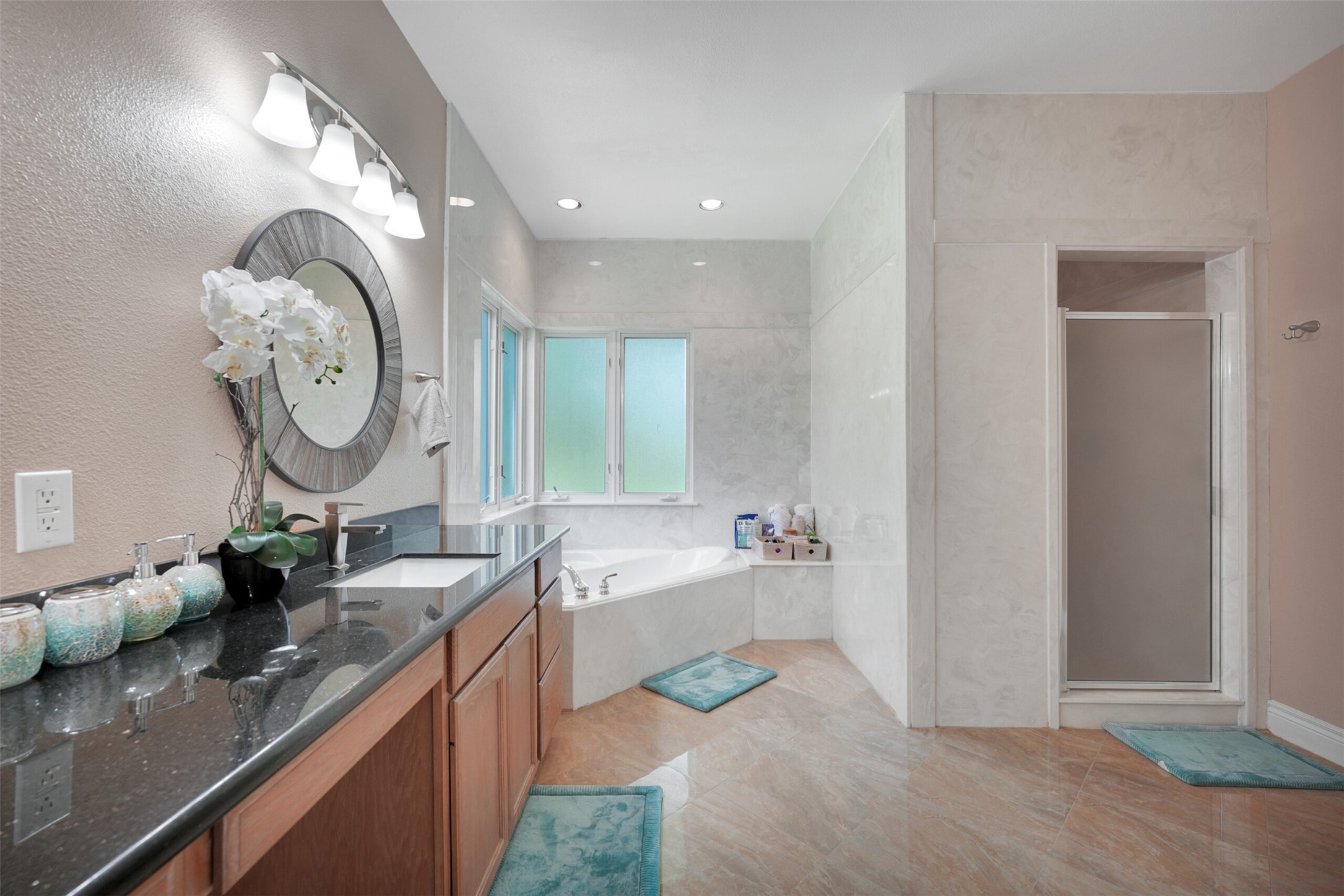 2750 County Road 48 Rosharon, TX 77583 - Photo 25 of 40 a spacious bathroom with a double vanity sink and a mirror