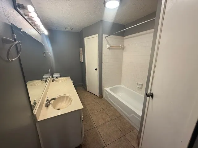 a bathroom with a sink and shower