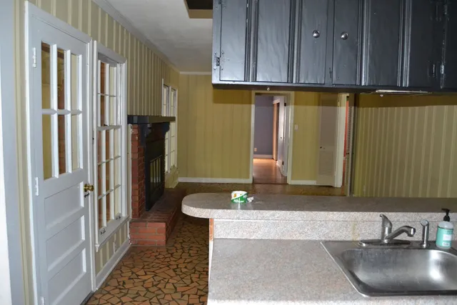 a bathroom with a sink a toilet and a shower