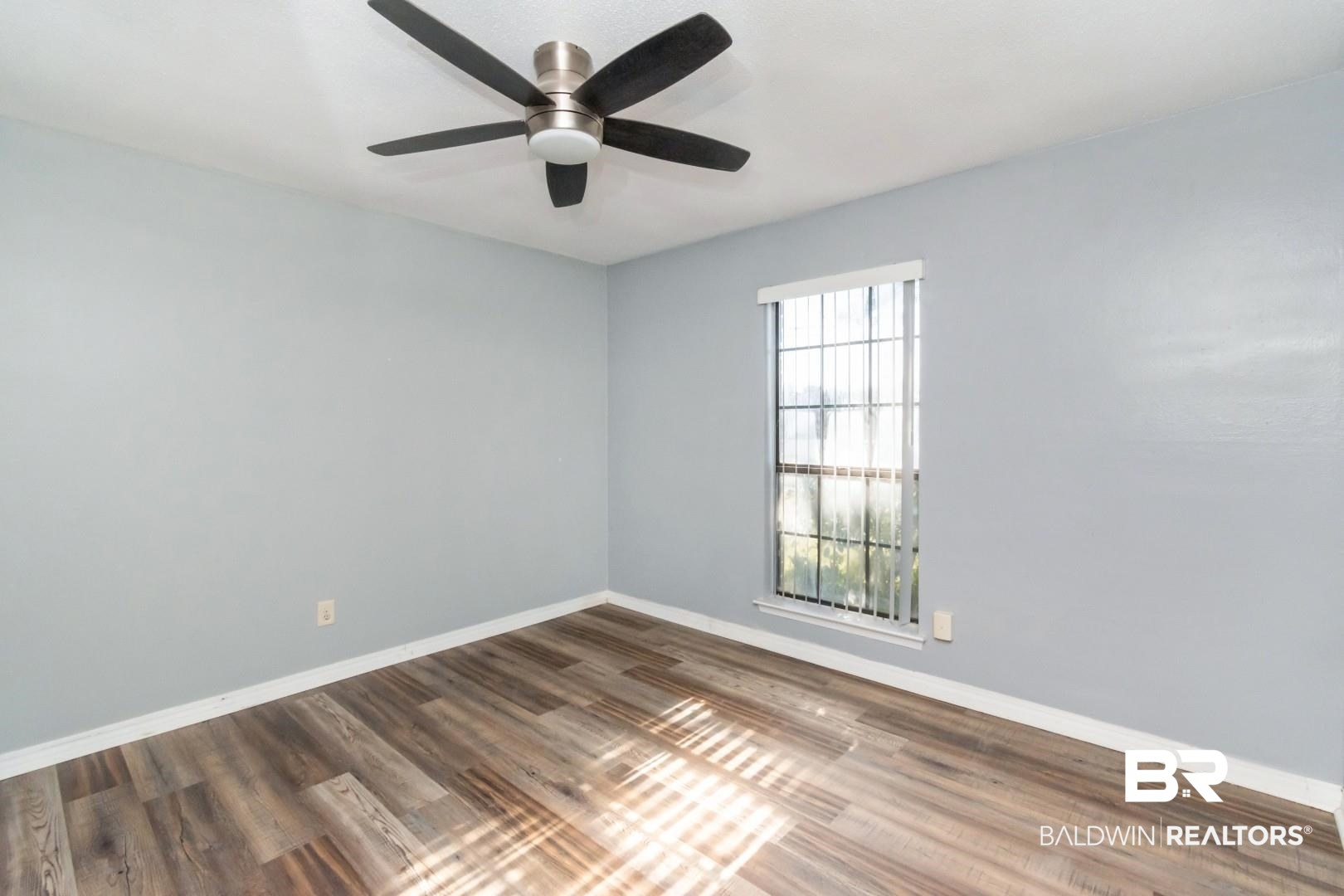 8304 Champlain Circle Mobile, AL 36695 - Photo 26 of 46 Unfurnished room with dark hardwood / wood-style floors