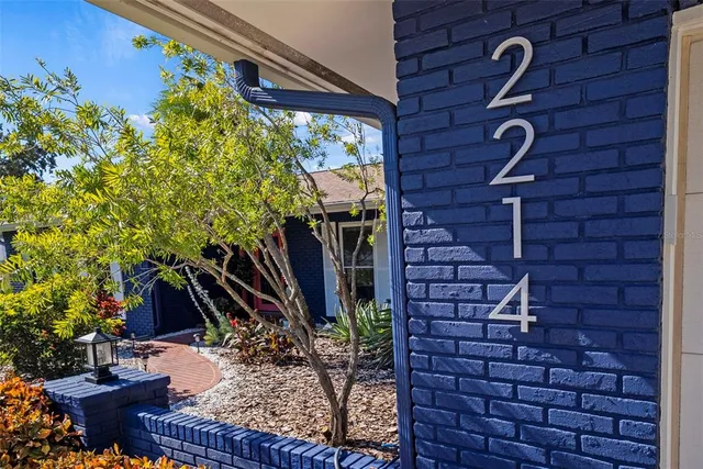 a view of a bedroom with wooden floor and stairs