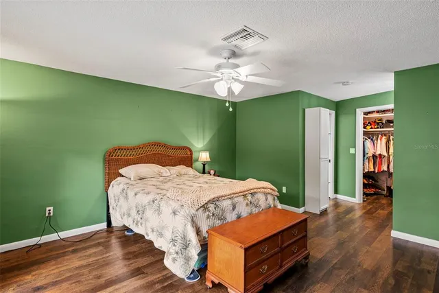 a view of a porch with a table and chairs