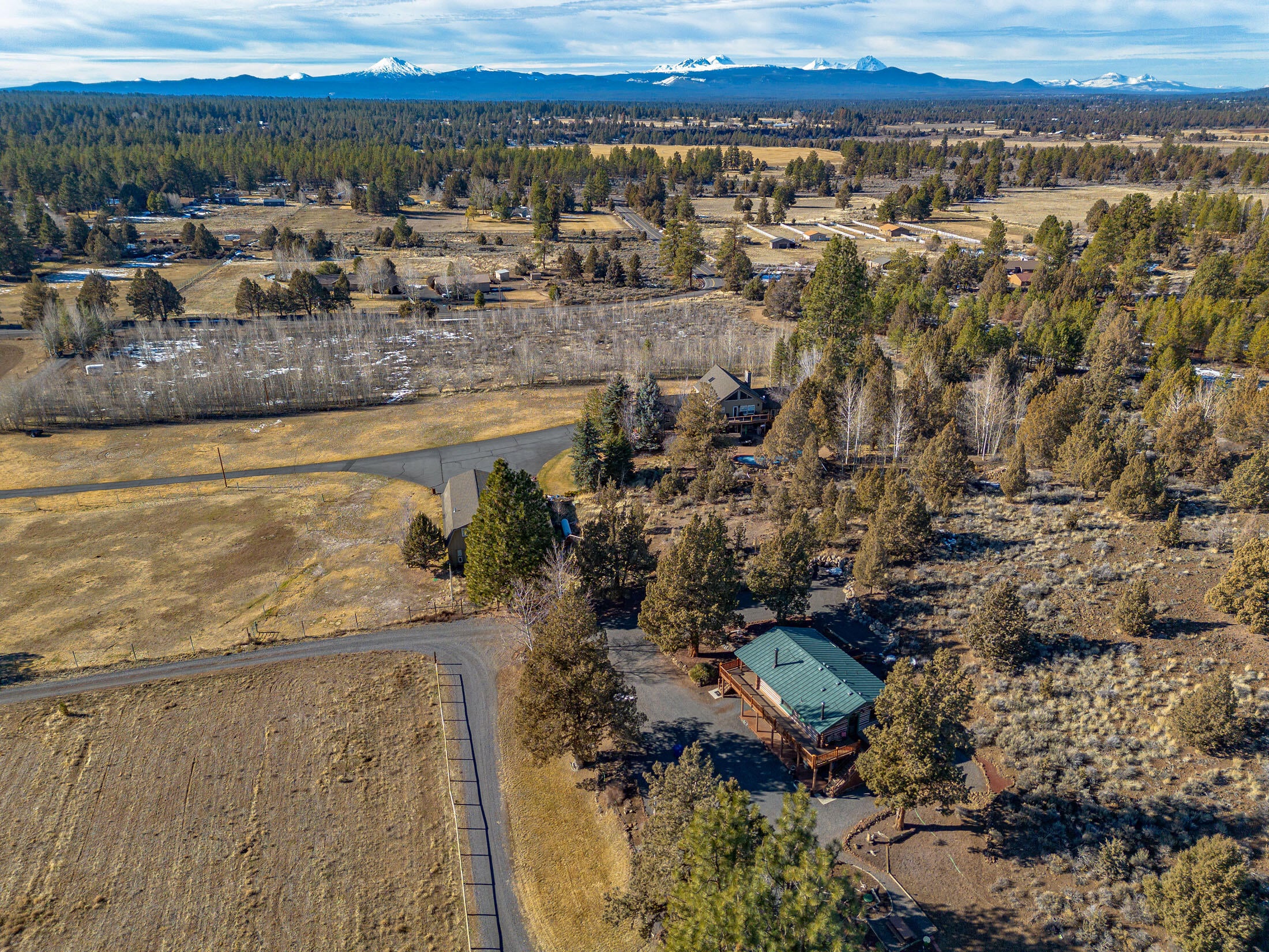 Aerial view toward the West and some surrounding properties.