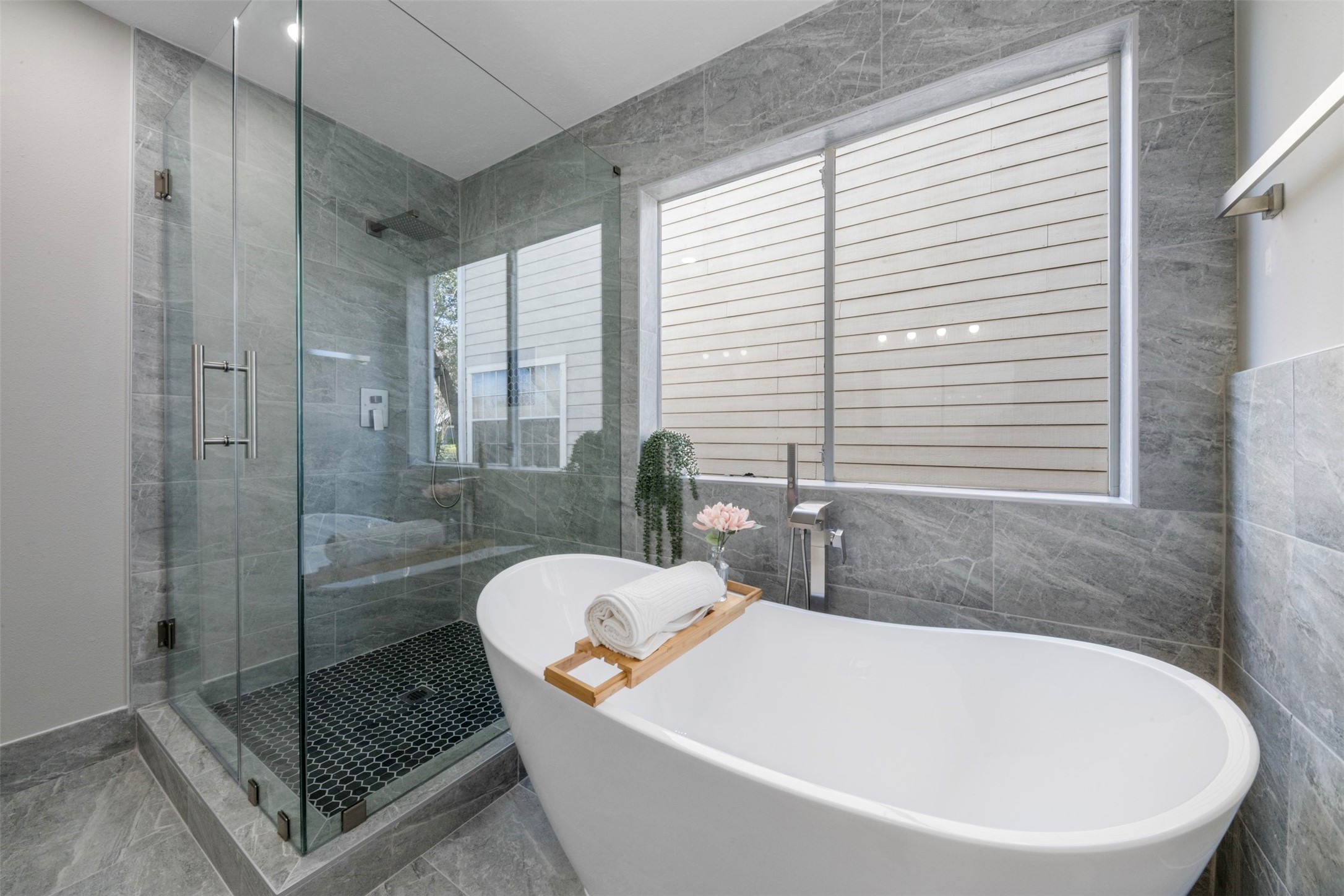 9606 Farrell Drive Houston, TX 77070 - Photo 15 of 37 a white bath tub sitting next to a shower