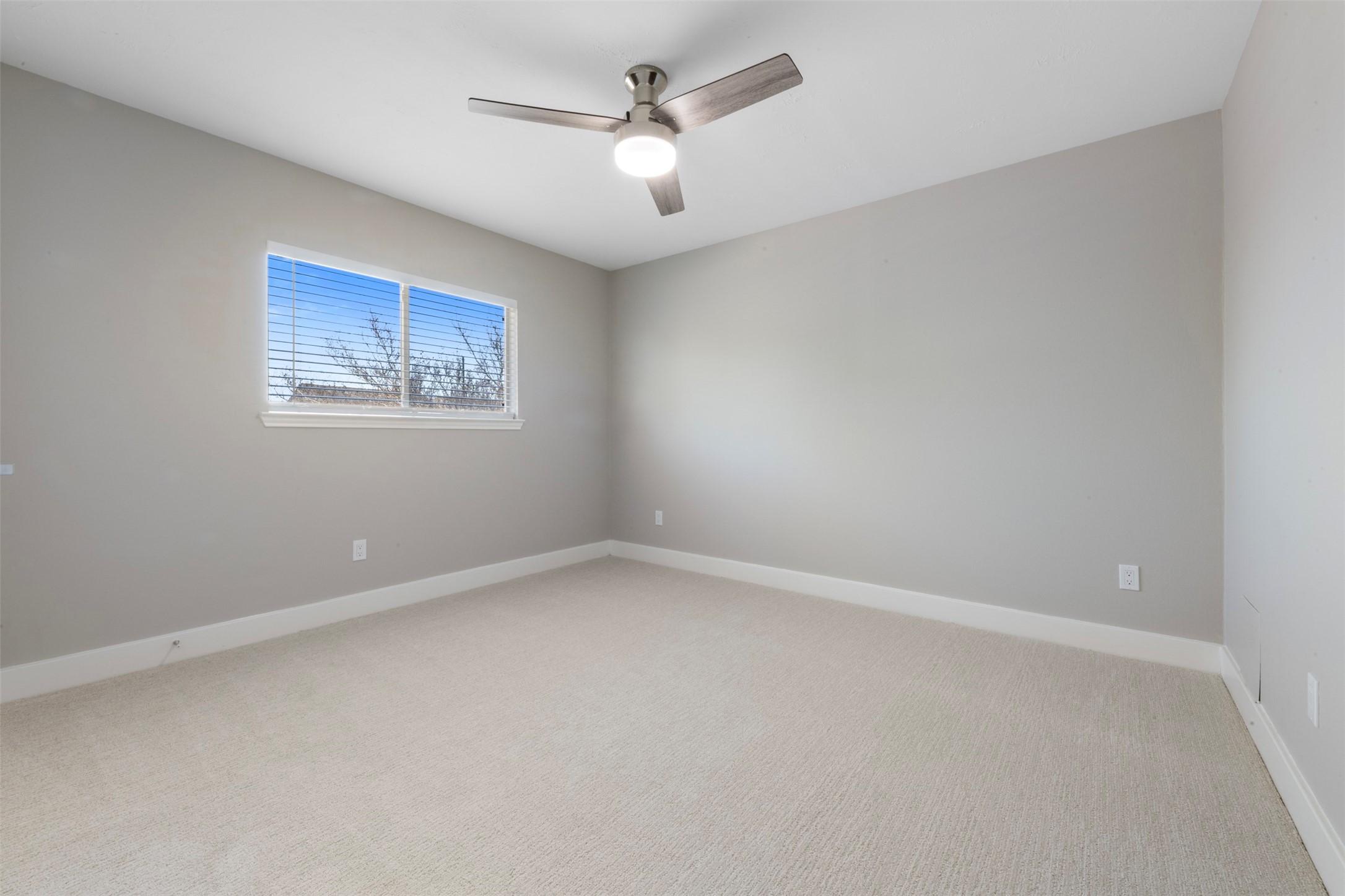 9606 Farrell Drive Houston, TX 77070 - Photo 22 of 37 an empty room with a window and a fan