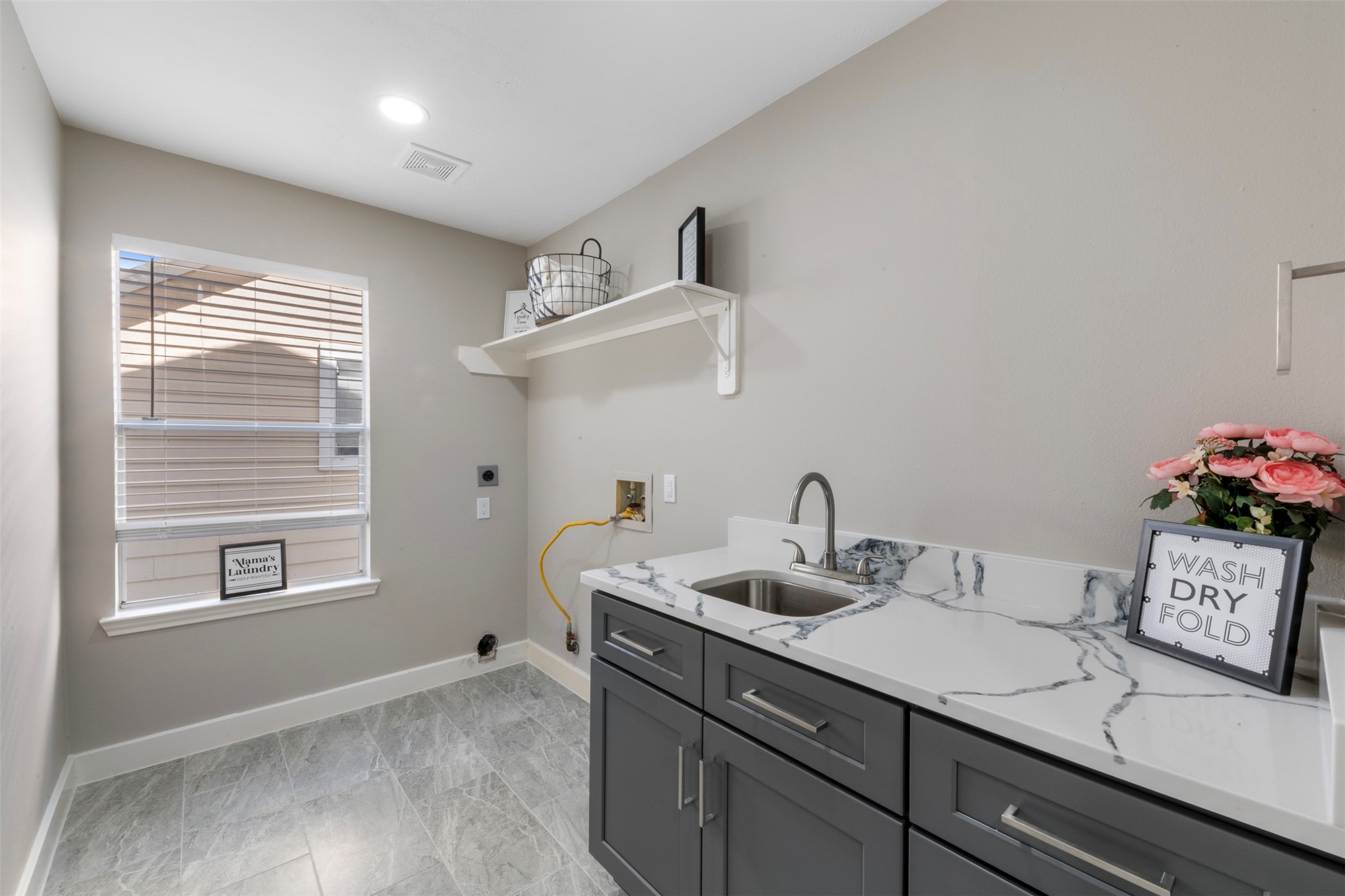 9606 Farrell Drive Houston, TX 77070 - Photo 25 of 37 a bathroom with a sink and a window