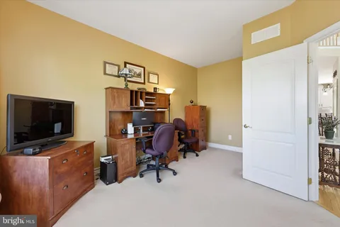 a view of a workspace with furniture