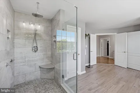 a bathroom with a shower and a toilet