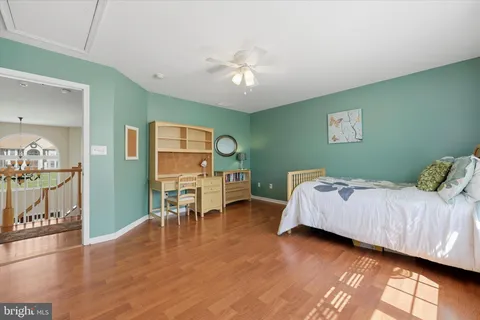 a bed room with a bed and a chandelier
