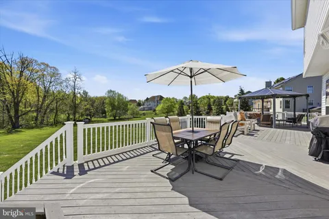 a view of a roof deck and wooden floor