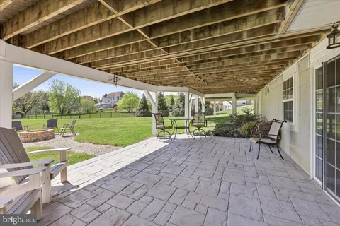 a view of a patio with a backyard