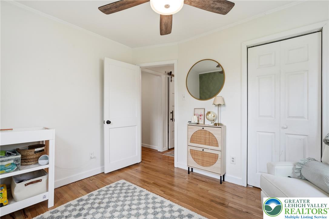408 Maple Road Hellertown, PA 18055 - Photo 20 of 66 Warm hardwood flooring flows throughout this cozy bedroom with a built-in closet.