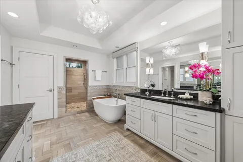 a bathroom with a sink and a large window