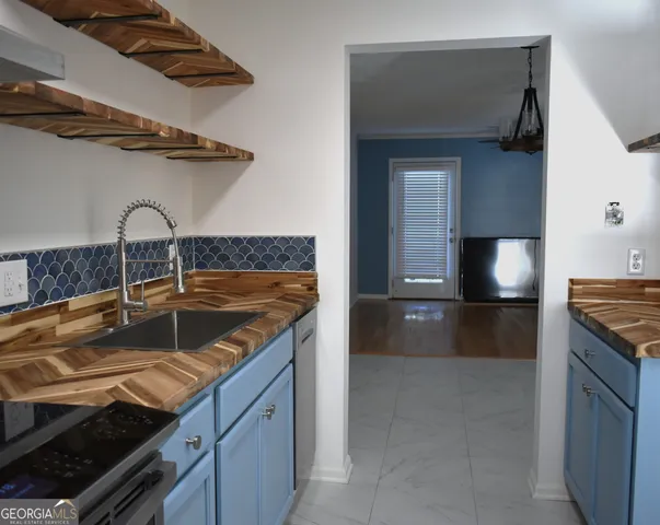 a kitchen with a stove and a sink
