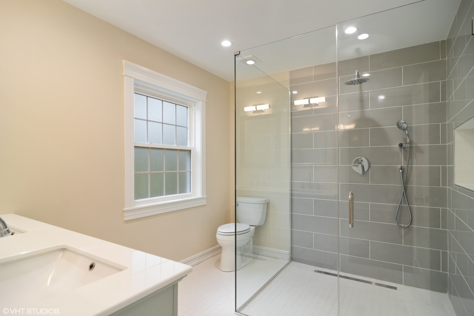 1652 Banbury Road Inverness, IL 60067 - Photo 13 of 28 a bathroom with a shower and a sink