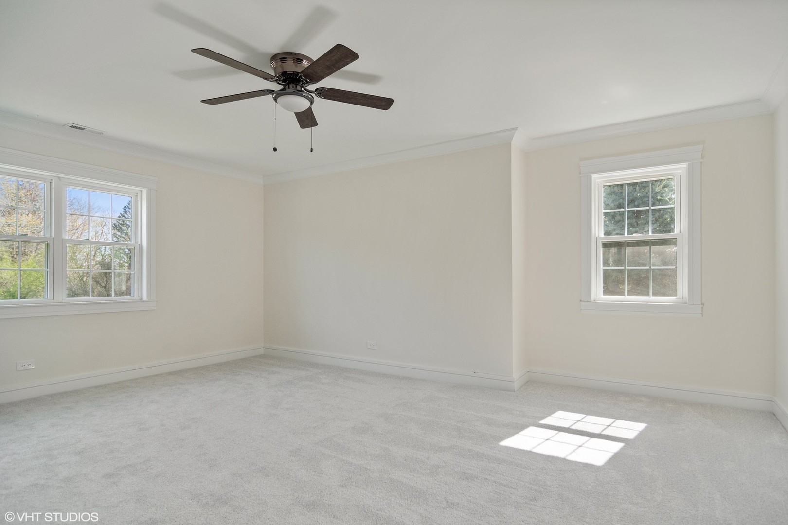 1652 Banbury Road Inverness, IL 60067 - Photo 16 of 28 an empty room with windows and ceiling fan