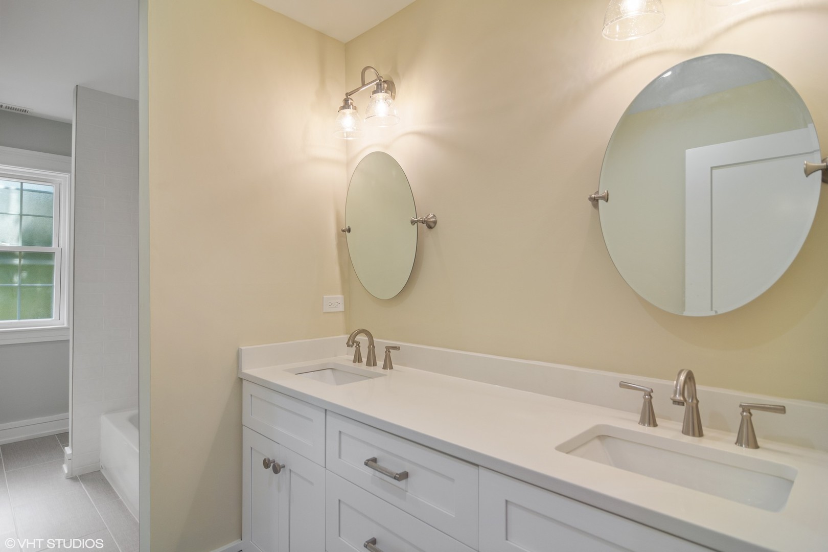 1652 Banbury Road Inverness, IL 60067 - Photo 19 of 28 a bathroom with a sink mirror and vanity