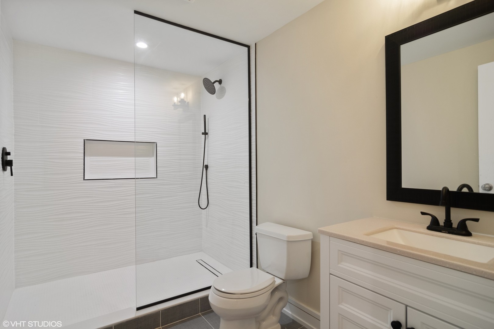 1652 Banbury Road Inverness, IL 60067 - Photo 20 of 28 a bathroom with a granite countertop sink a toilet and shower