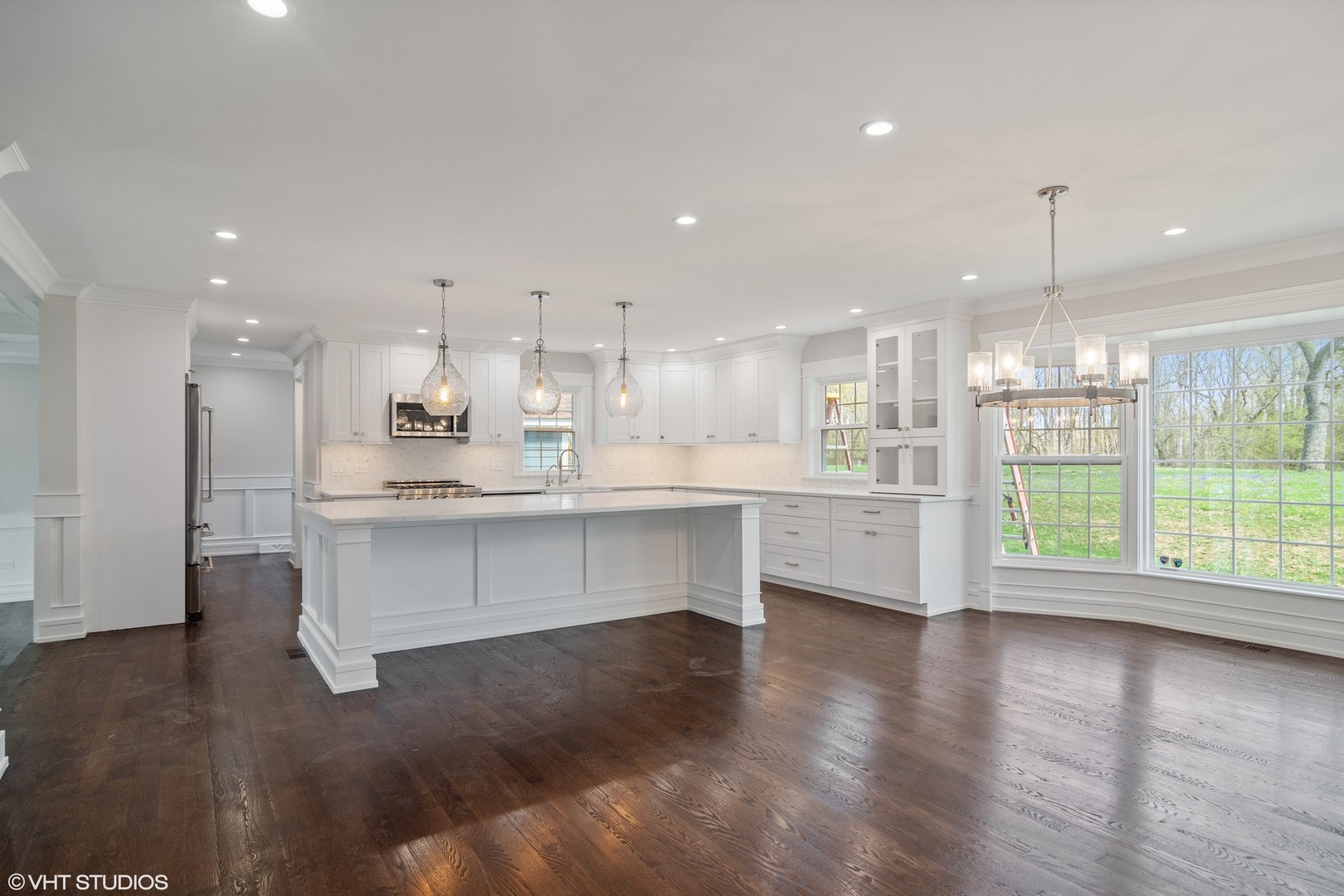 1652 Banbury Road Inverness, IL 60067 - Photo 5 of 28 a large white kitchen with lots of counter space wooden floor and appliances