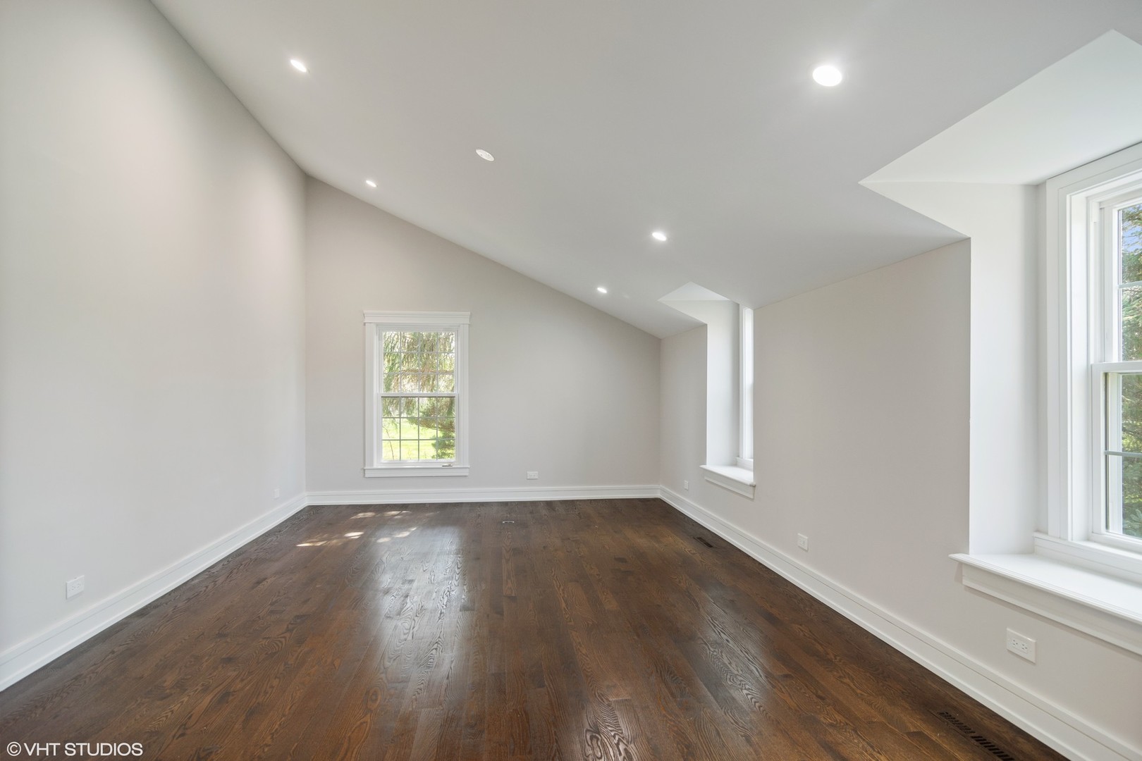 1652 Banbury Road Inverness, IL 60067 - Photo 10 of 28 an empty room with wooden floor and windows