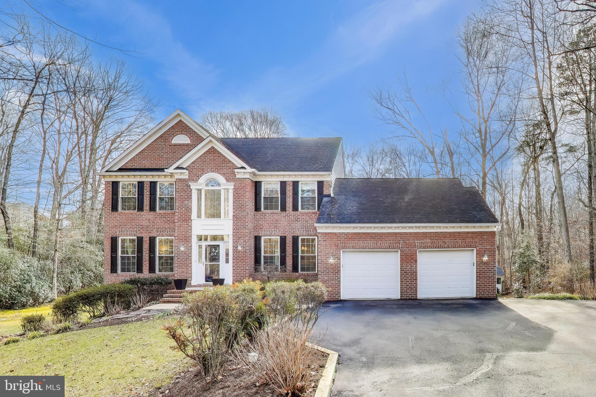 2623 Sequoia Way Prince Frederick, MD 20678 - Photo 1 of 57 a front view of a house with a yard and garage