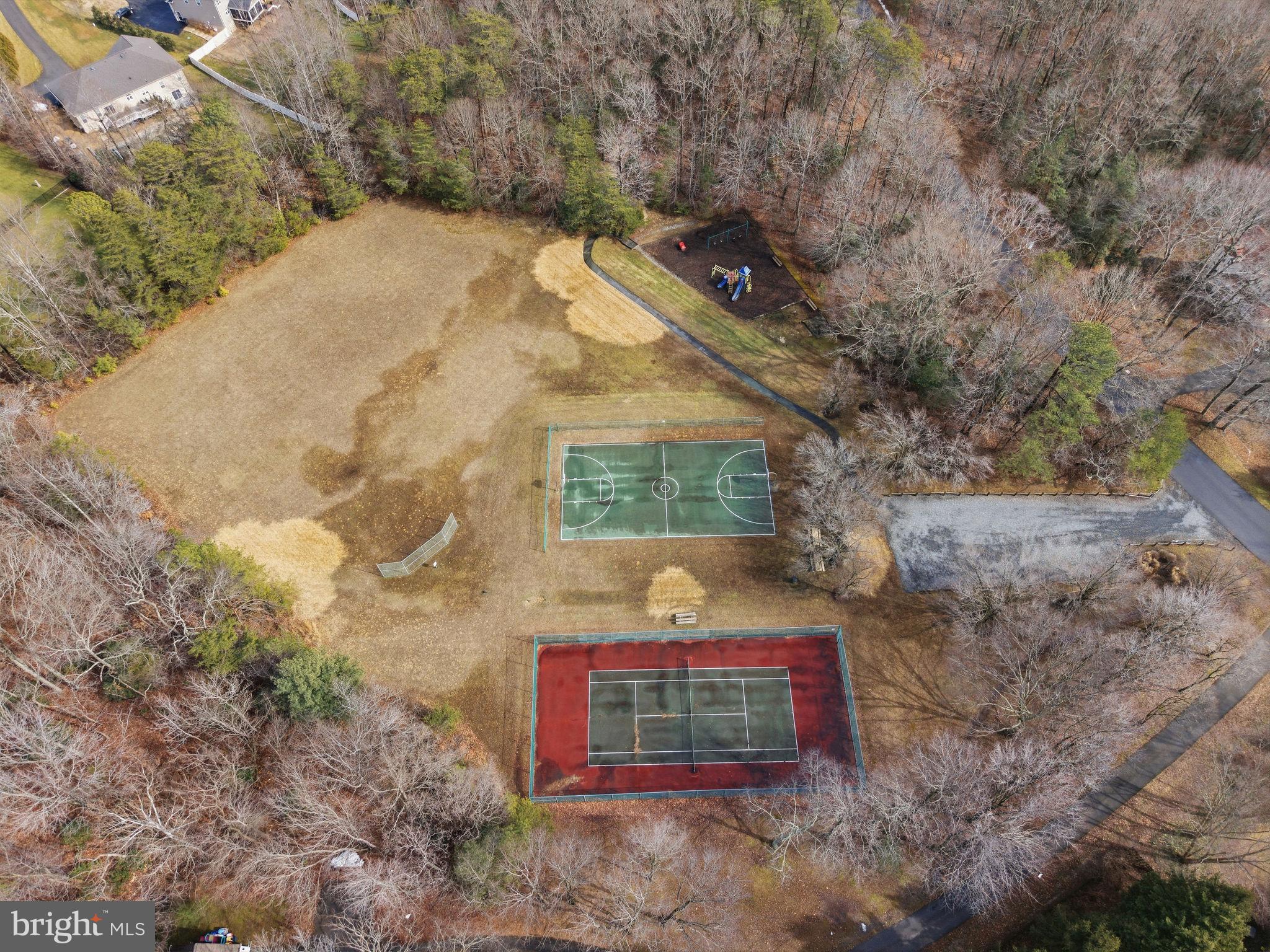 2623 Sequoia Way Prince Frederick, MD 20678 - Photo 16 of 57 a view of a stone wall with large trees