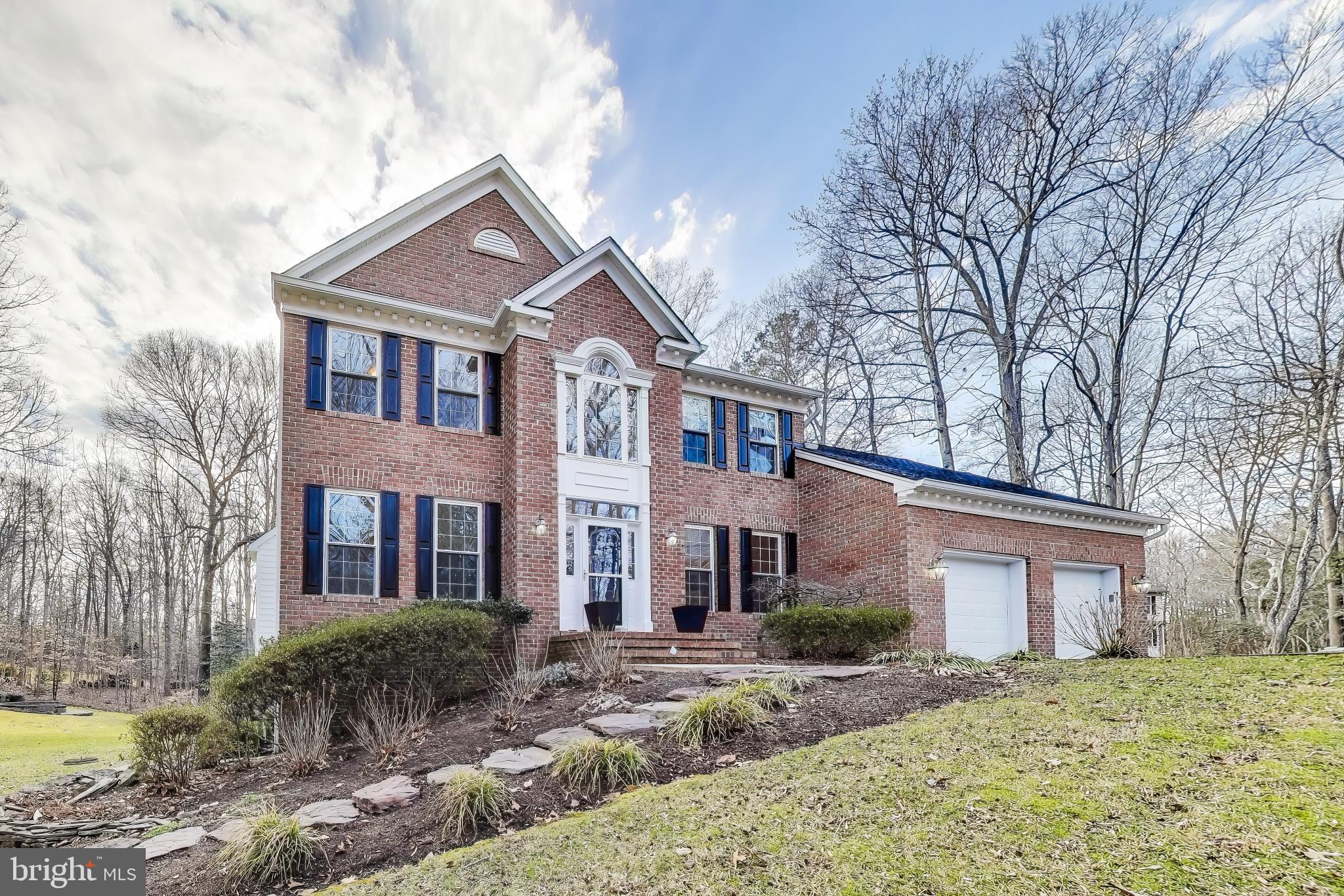 2623 Sequoia Way Prince Frederick, MD 20678 - Photo 18 of 57 a front view of a house with a yard
