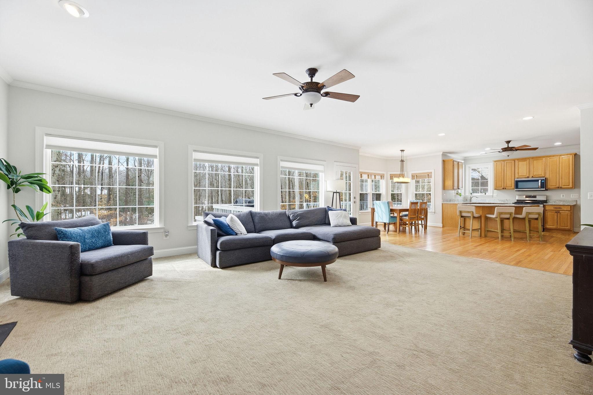 2623 Sequoia Way Prince Frederick, MD 20678 - Photo 20 of 57 a living room with furniture and a large window