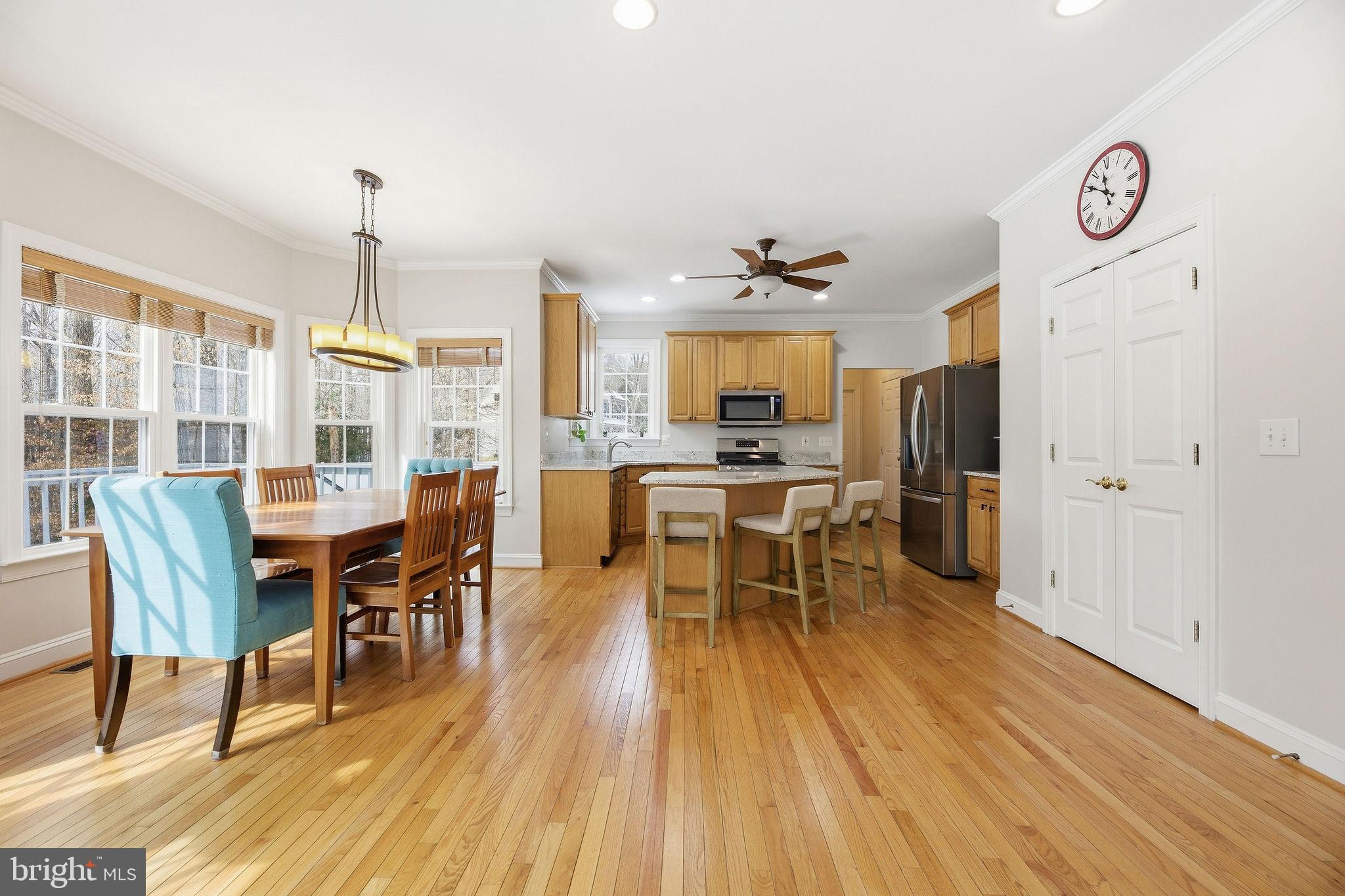 2623 Sequoia Way Prince Frederick, MD 20678 - Photo 23 of 57 a view of a dining room with furniture window and wooden floor