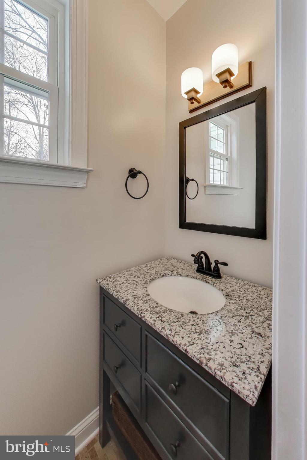 2623 Sequoia Way Prince Frederick, MD 20678 - Photo 26 of 57 a bathroom with a granite countertop sink and a mirror