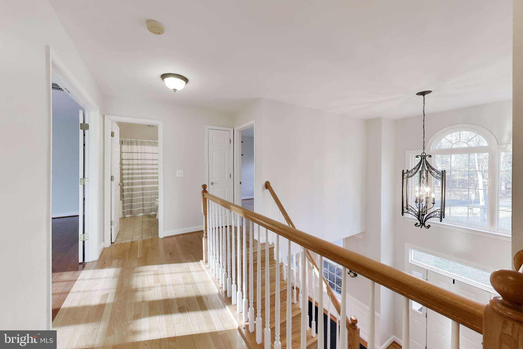 2623 Sequoia Way Prince Frederick, MD 20678 - Photo 29 of 57 a view of a room with wooden floor and stairs
