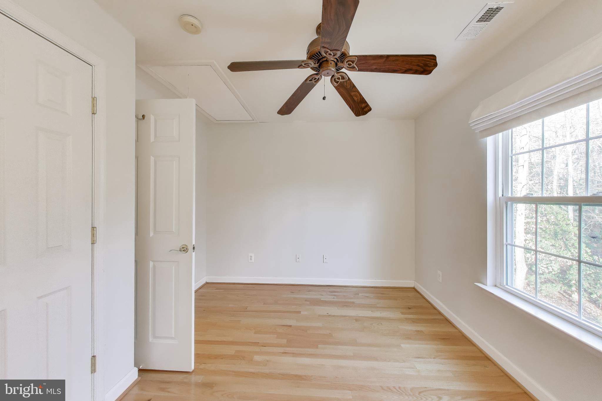 2623 Sequoia Way Prince Frederick, MD 20678 - Photo 34 of 57 a view of empty room with wooden floor and window