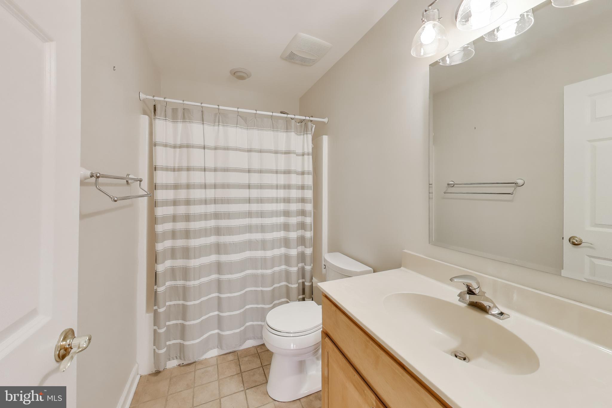 2623 Sequoia Way Prince Frederick, MD 20678 - Photo 35 of 57 a bathroom with a sink toilet and shower