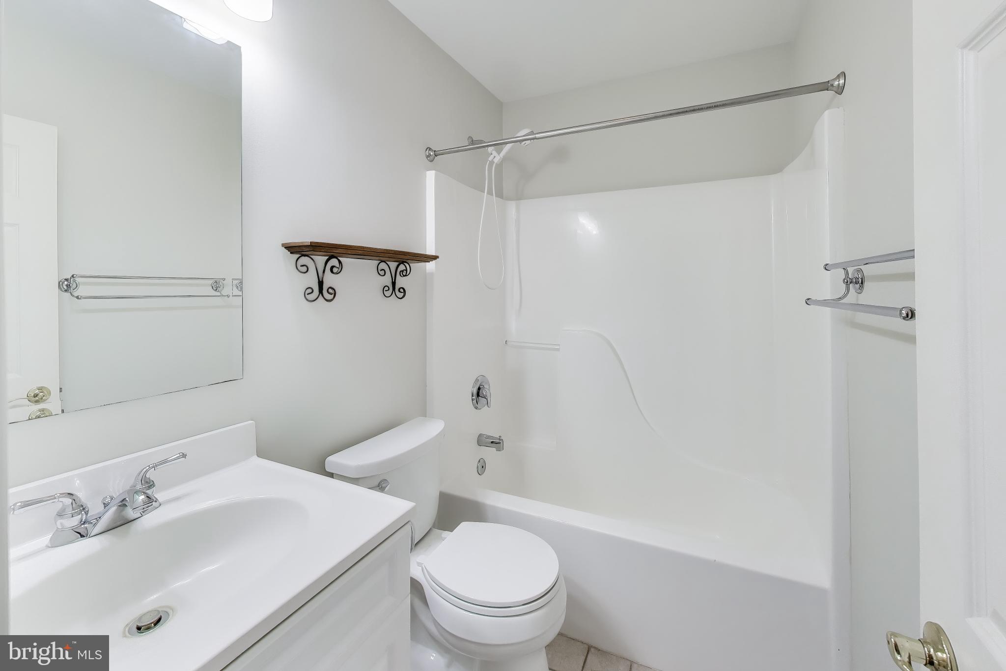 2623 Sequoia Way Prince Frederick, MD 20678 - Photo 39 of 57 a bathroom with a sink a toilet and shower