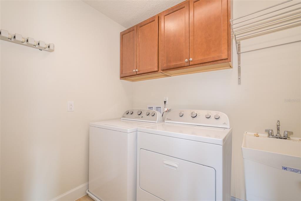 12012 Talitha Lane Orlando, FL 32827 - Photo 18 of 29 a utility room with dryer and washer