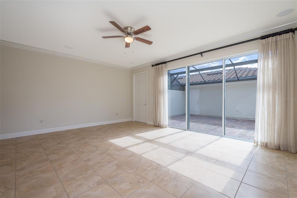 12012 Talitha Lane Orlando, FL 32827 - Photo 6 of 29 a big room with closet and fan
