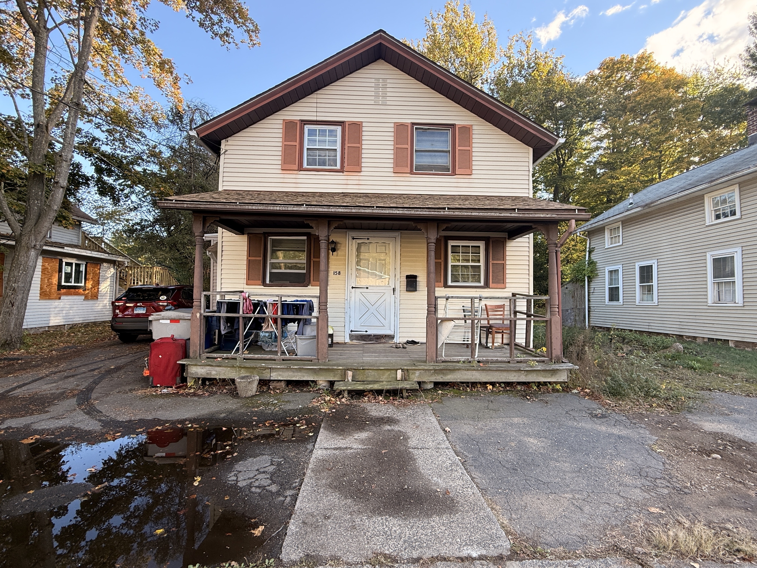 158 East Main Street Bristol, CT 06010 - Photo 1 of 19 a front view of a house with garden