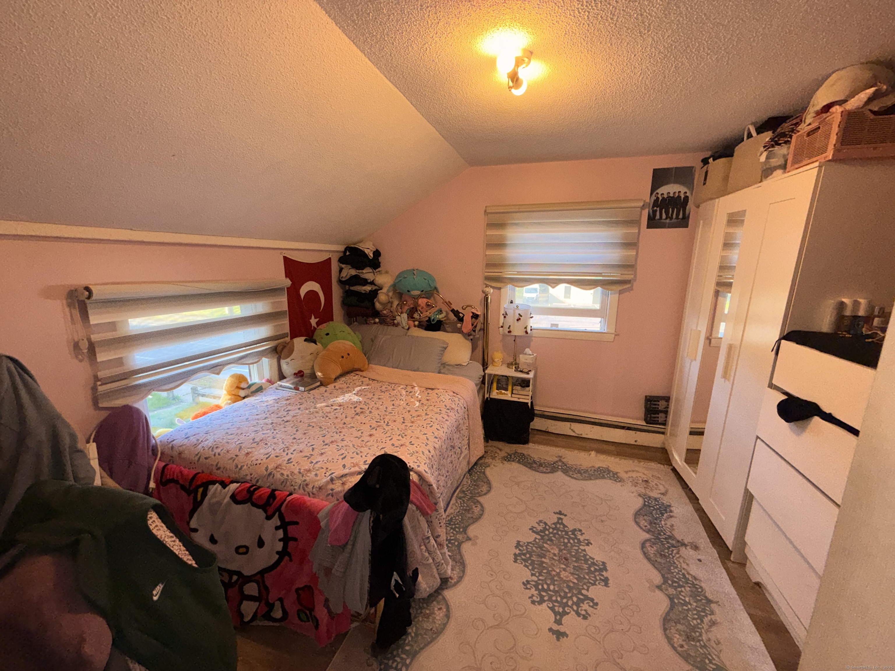 158 East Main Street Bristol, CT 06010 - Photo 13 of 19 a bed room with a bed and a window