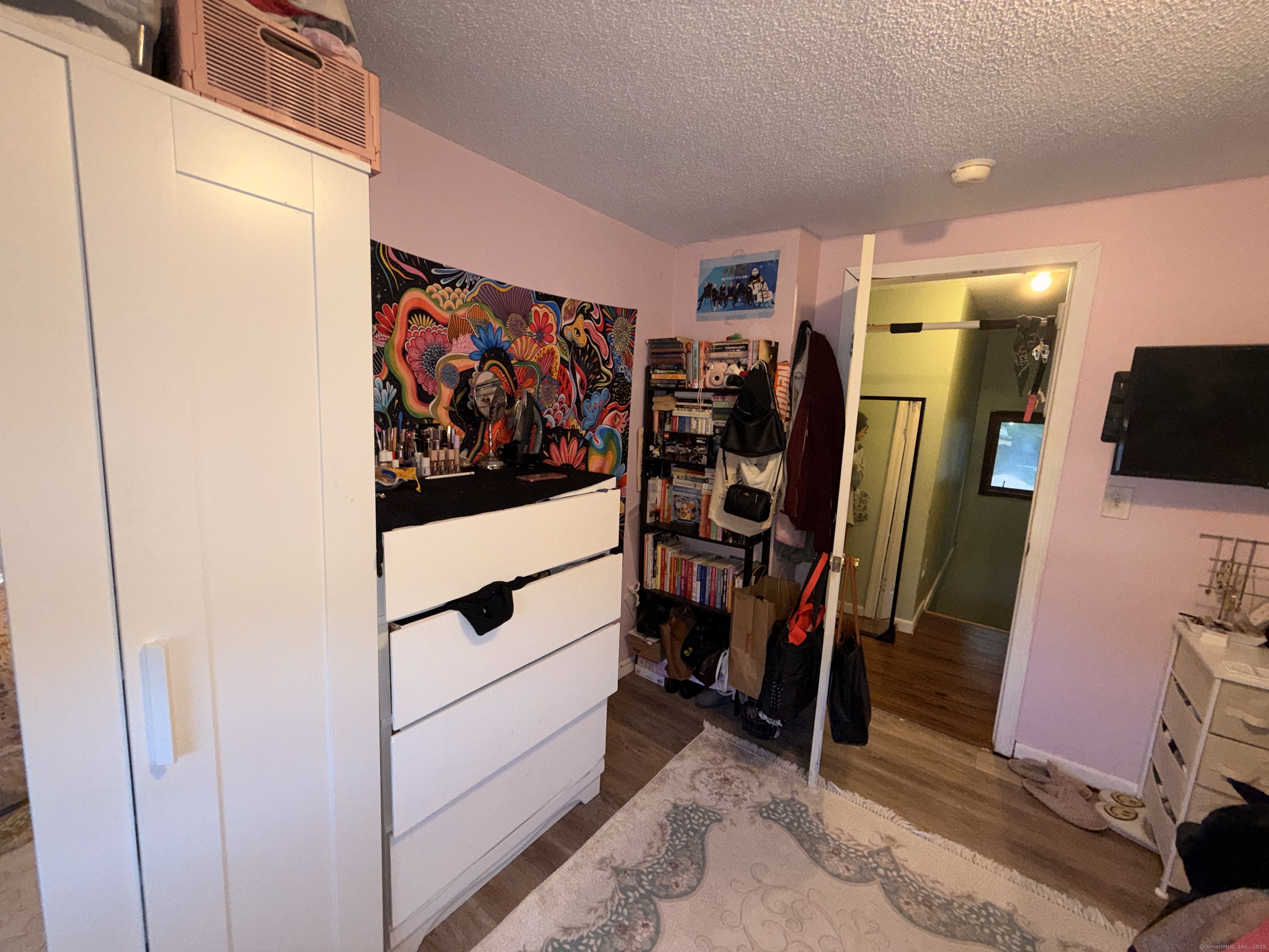 158 East Main Street Bristol, CT 06010 - Photo 14 of 19 a view of walk in closet with clothes