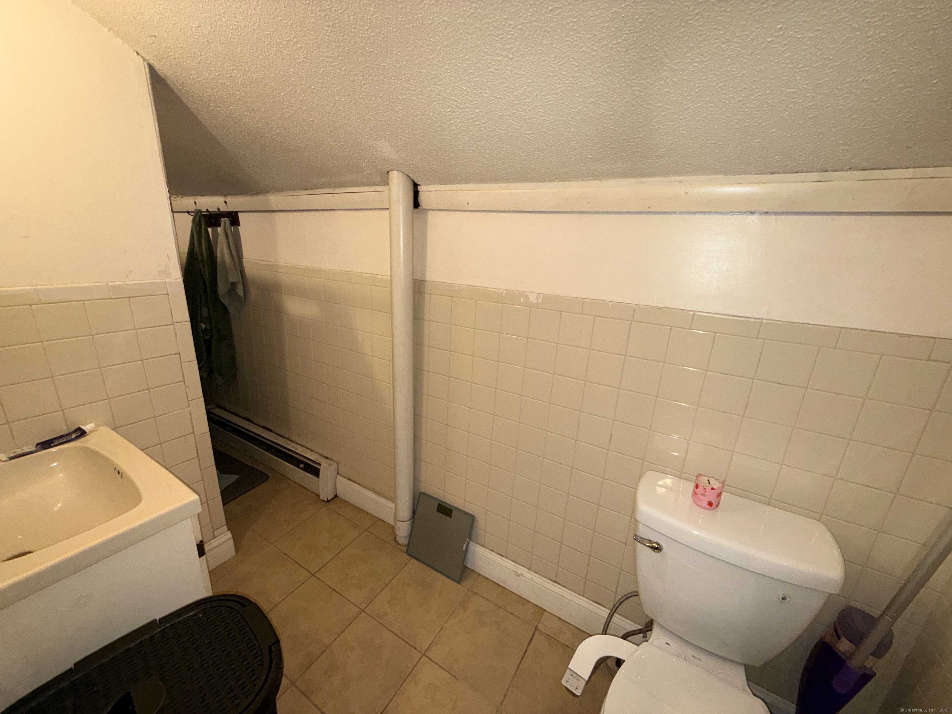 158 East Main Street Bristol, CT 06010 - Photo 18 of 19 a bathroom with a toilet and a shower