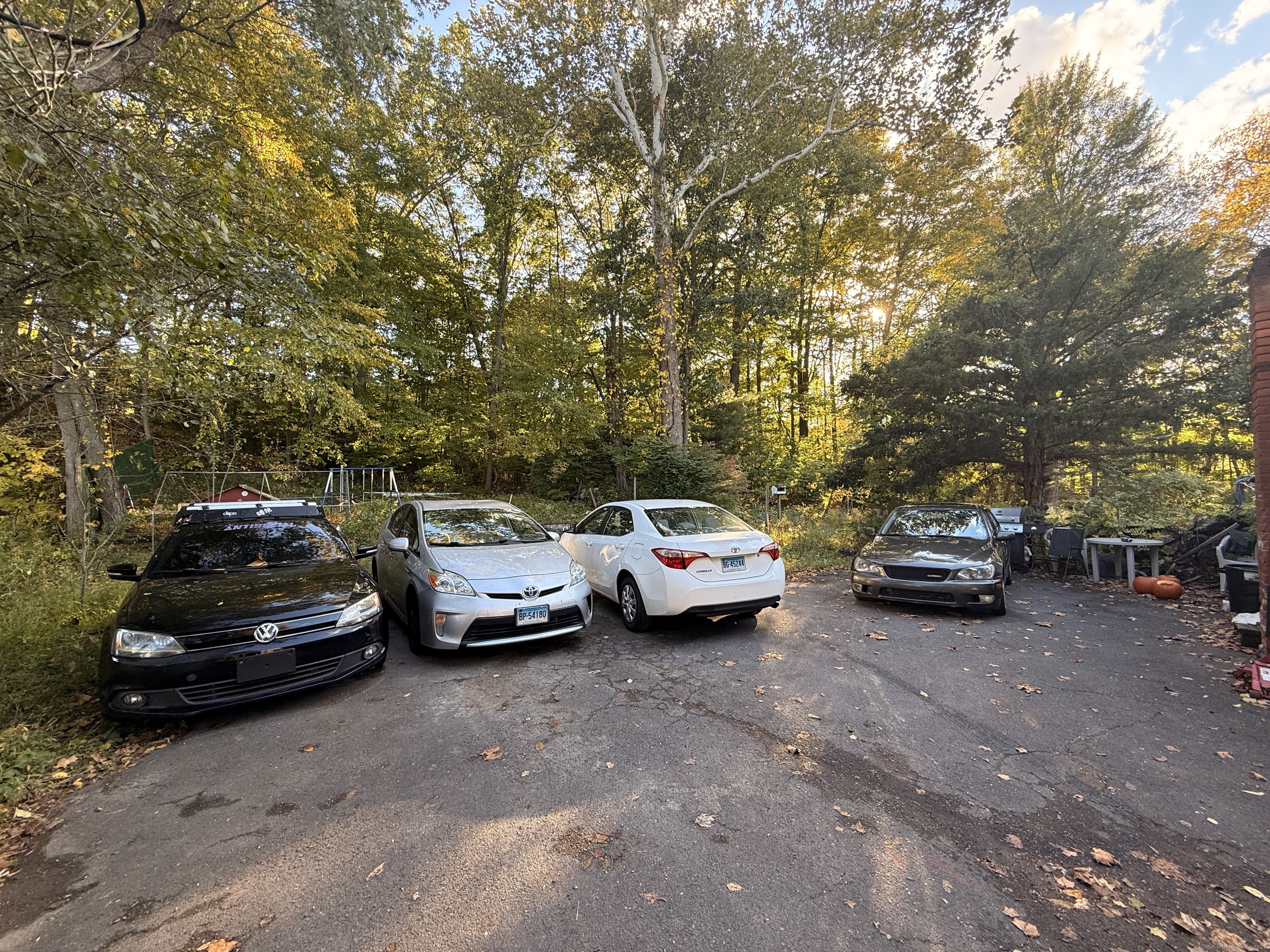 158 East Main Street Bristol, CT 06010 - Photo 4 of 19 a view of a cars parked in a parking lot