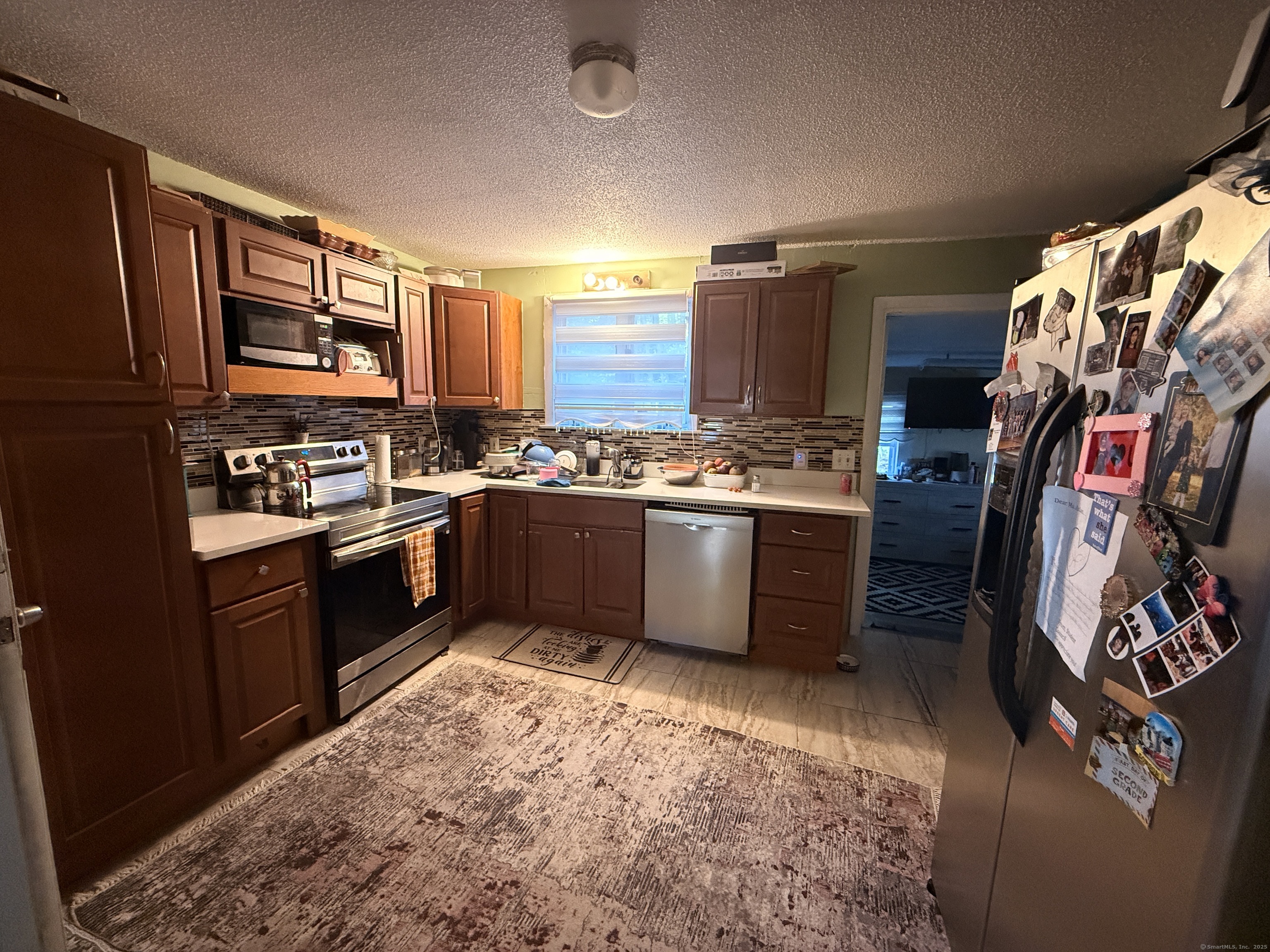 158 East Main Street Bristol, CT 06010 - Photo 5 of 19 a kitchen with stainless steel appliances granite countertop a sink stove and refrigerator