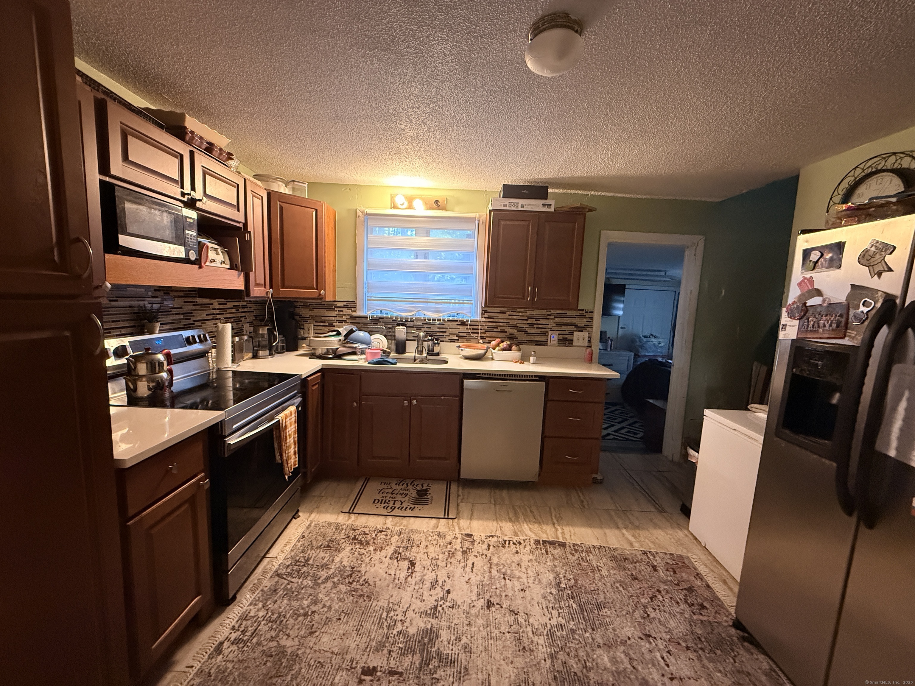 158 East Main Street Bristol, CT 06010 - Photo 6 of 19 a kitchen with stainless steel appliances granite countertop a stove a sink dishwasher and a refrigerator