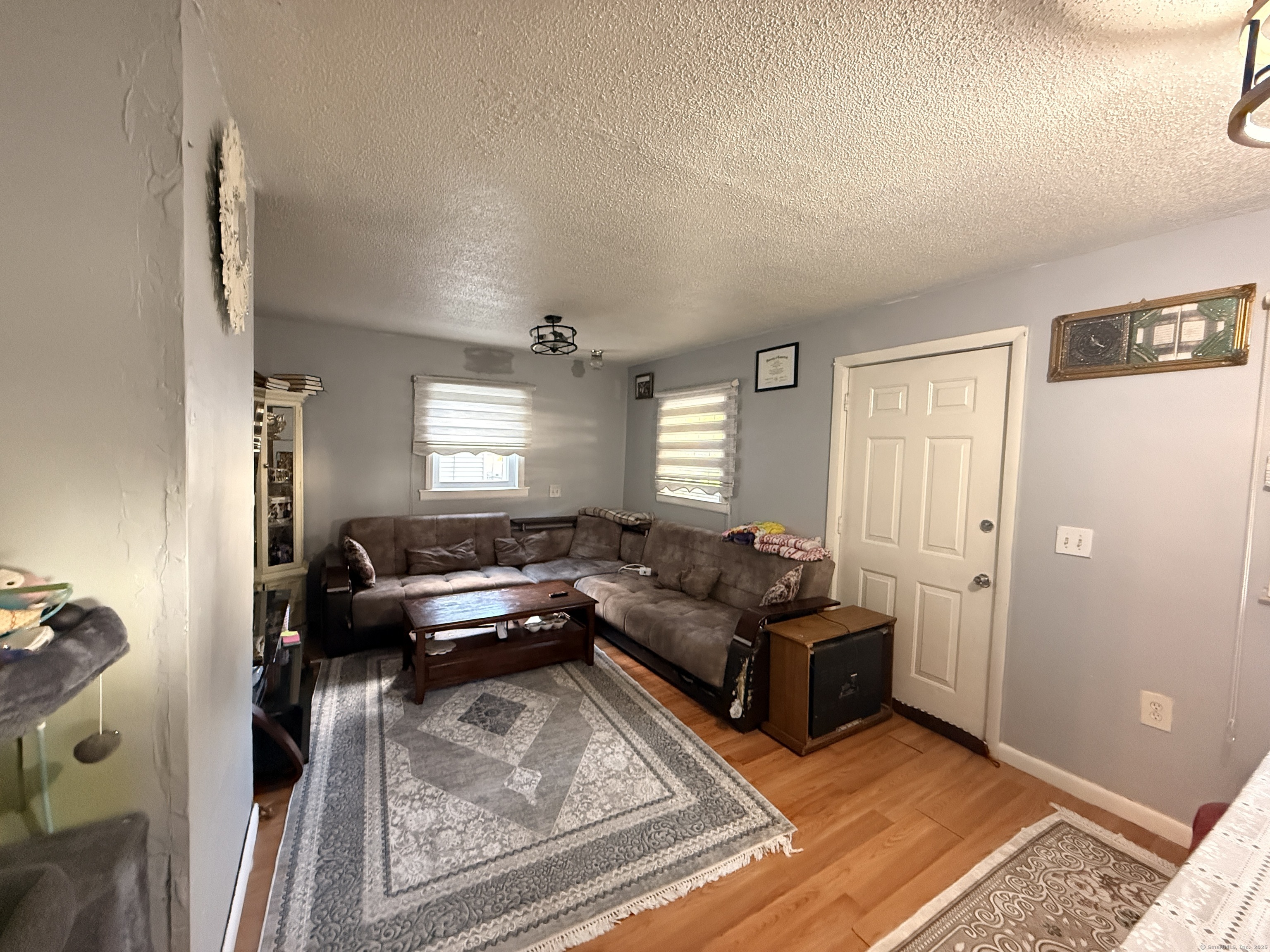 158 East Main Street Bristol, CT 06010 - Photo 7 of 19 a living room with furniture and a window